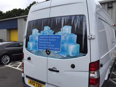 Picture of rear panel on a van with the wrapping cut to shape showing picture of ice cubes for cold storage company